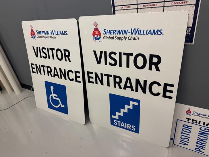 An image of Sherwin Williams aluminum Visitor Entrance signage.
